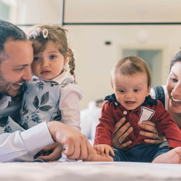 happy-family-with-two-kids-indoor-at-home-playing-2022-01-21-23-19-46-utc (1)