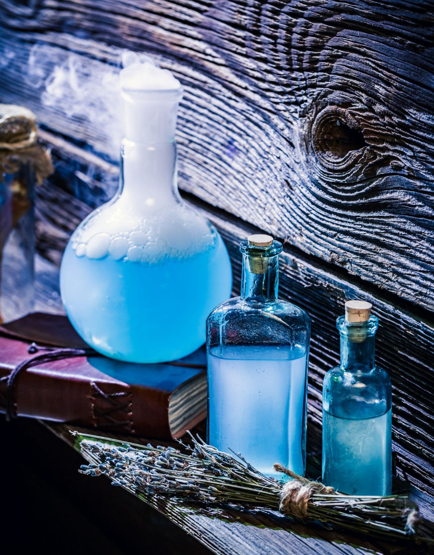 closeup-of-magical-blue-potions-in-witch-cottage-f-2022-04-11-21-10-34-utc